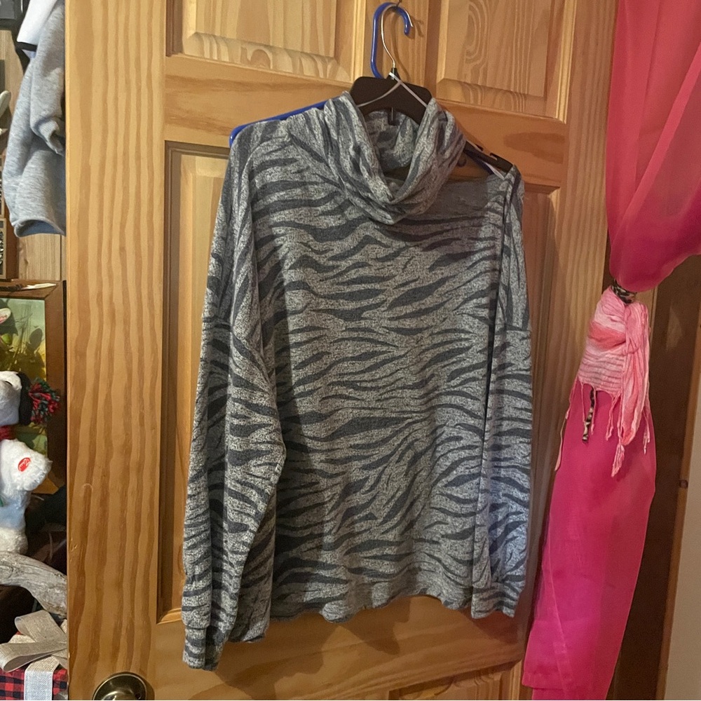 Three shirts for one price zebra print with one open shoulder light and soft 1x